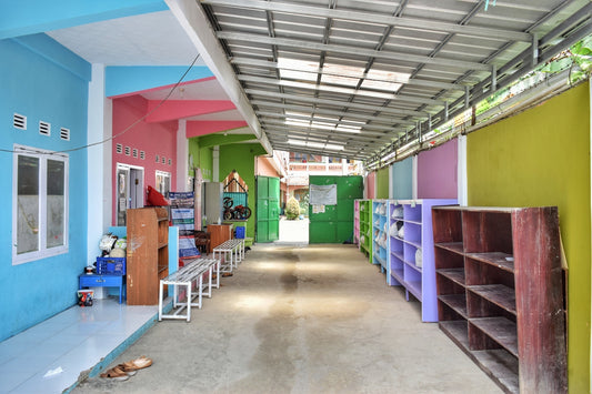 a long hallway with a bunch of shelves on the side of it