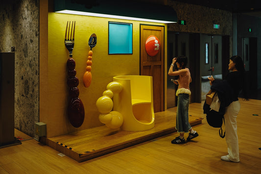 People admiring an abstract art exhibit.